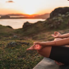 Photo of a person meditating in nature