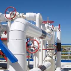 pipes with red valves at oil refinery