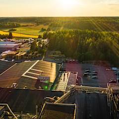 a paroc factory in Parainen with green forests in the background