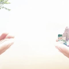 Two sets of hands. One holding a tree and the other holding a cityscape showing the importance of sustainability in urban design.