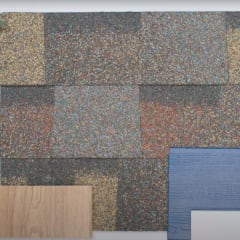 Lay flat view Shingle swatch with paint chip samples in two shades of blue, a black door handle, and a lantern.