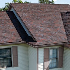 Tan home with Owens Corning Duration Designer shingles in Merlot.