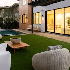 Clear huge sliding glass windows with in ground pool and outdoor furniture