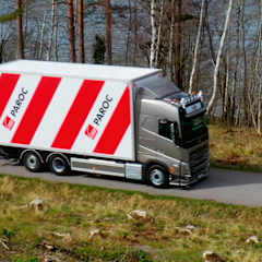 A red and white striped Paroc truck on the road