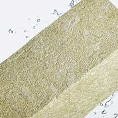 Stone wool insulation with water droplets demonstrating water-repellent properties to minimize the risk of corrosion under insulation (CUI).