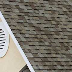 Closeup of a roof peak with Owens Corning Algae Resistant shingles.