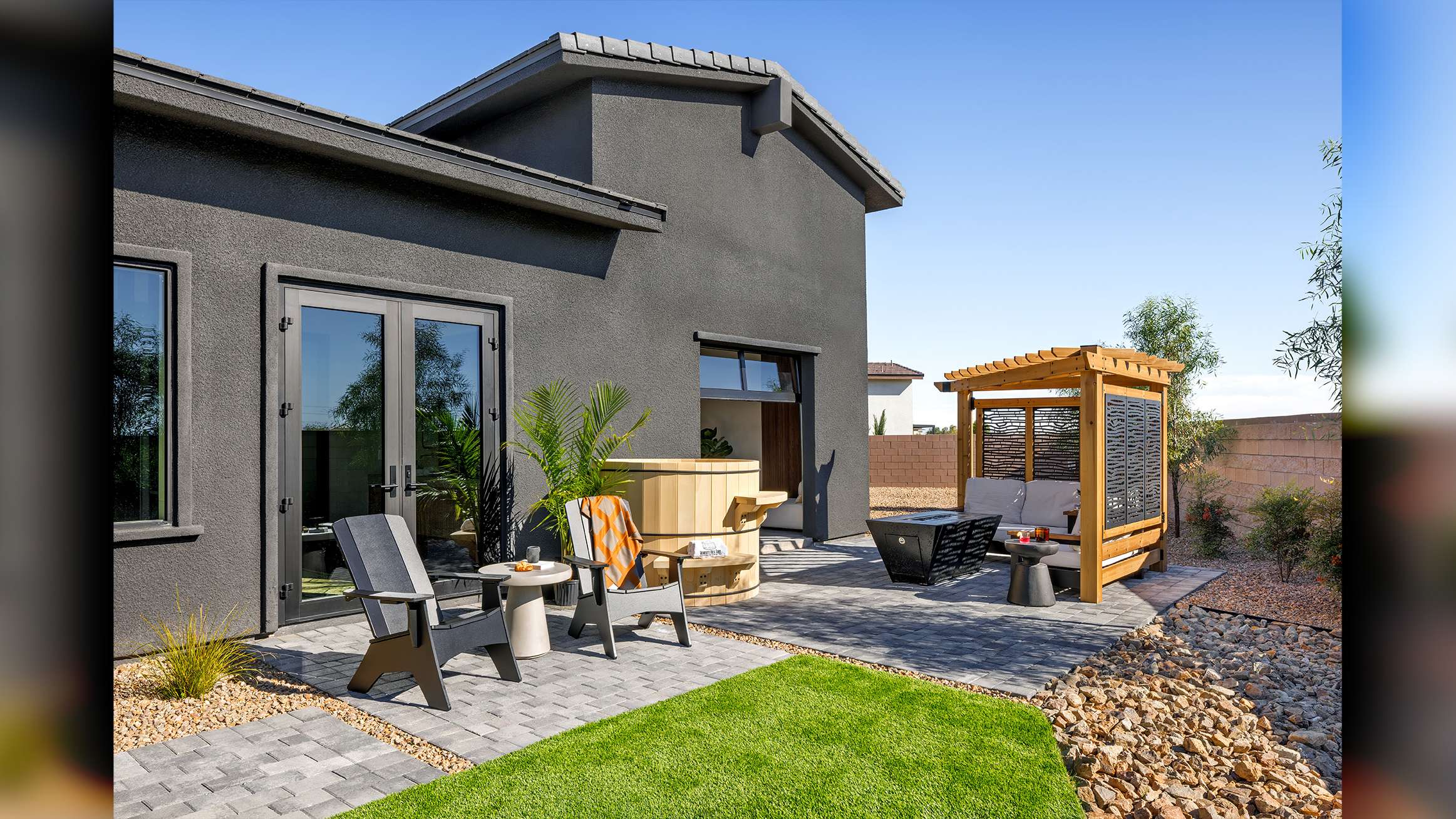 beautiful Las Vegas, Nevada home interior design, luxury sliding doors by Fleetwood living area extending into exterior patio