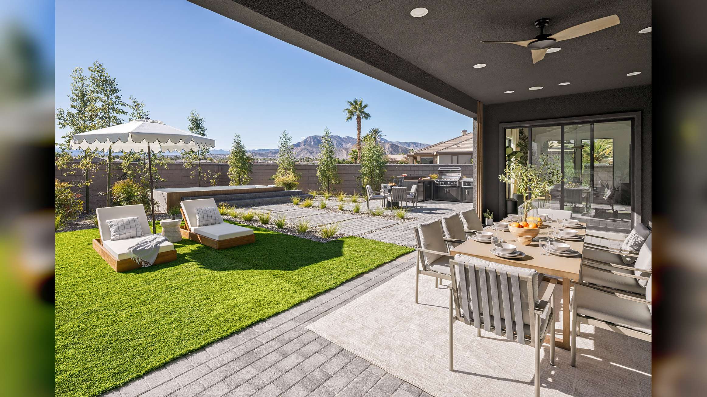 beautiful Las Vegas, Nevada home interior design, luxury sliding doors by Fleetwood living area extending into exterior patio