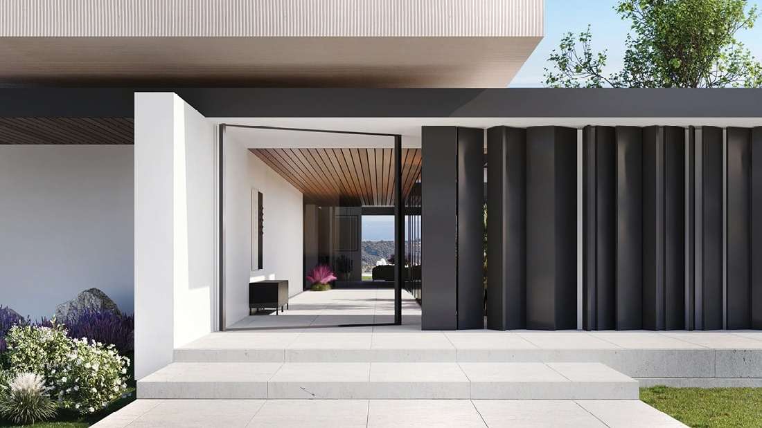 Modern minimalist house entrance with black vertical panels, white walls, and large glass door opening to a sleek interior with wooden ceiling and outdoor landscaping.