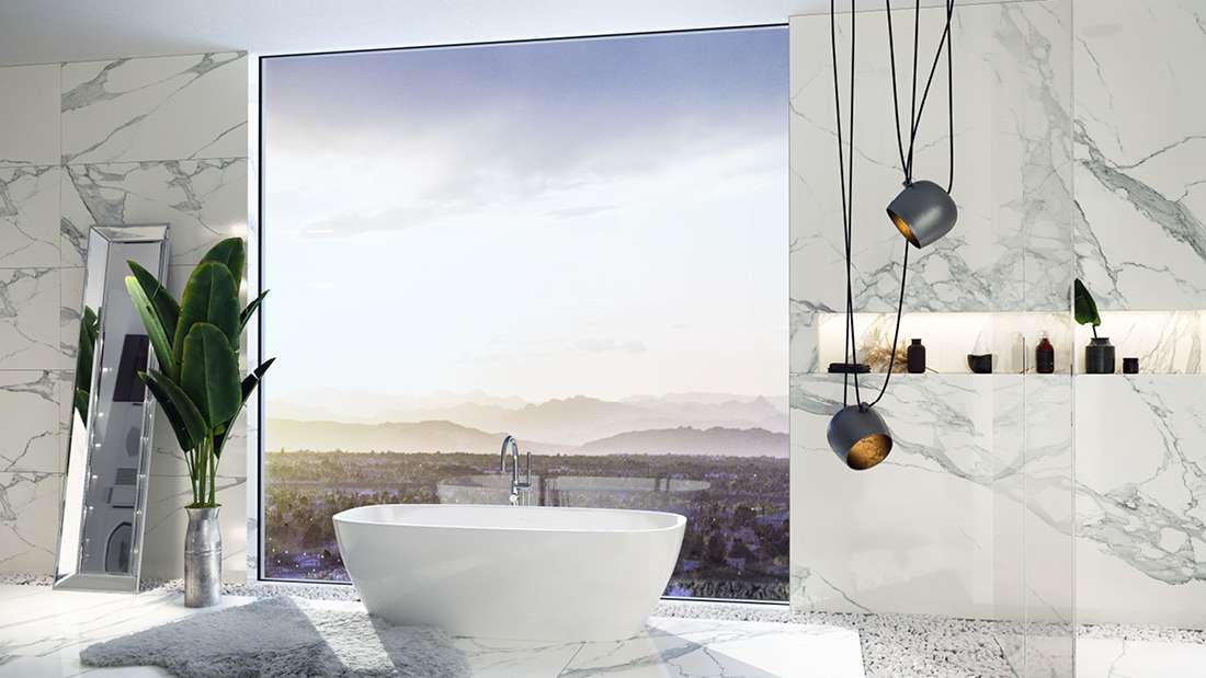 Luxury bathroom with freestanding white bathtub, large panoramic window overlooking scenic landscape, marble walls, modern pendant lights, and indoor plant decor.