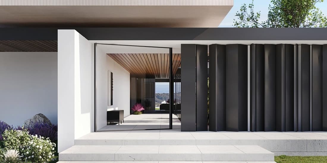Modern minimalist house entrance with black vertical panels, white walls, and large glass door opening to a sleek interior with wooden ceiling and outdoor landscaping.