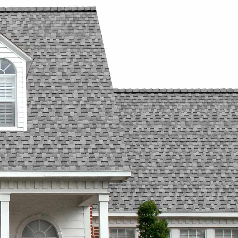 The porch entryway to a home depicts how well Sierra Gray TruDefinition® Duration® light gray, white, and black shingles pair with the white horizontal paneling and a woodgrain door with white columns."