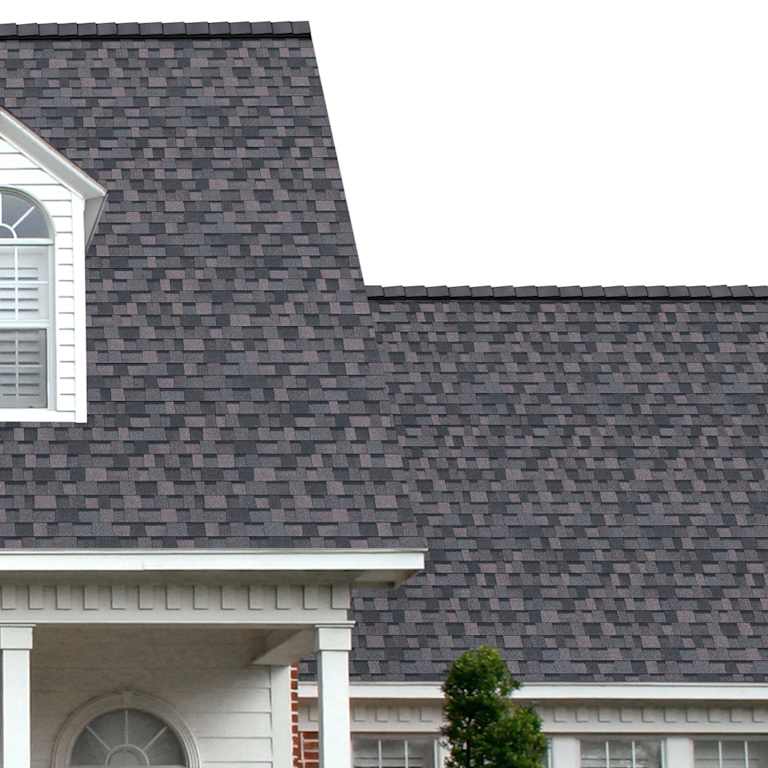 The porch entryway to a home depicts how well TruDefinition® Duration® Midnight Plum dark gray, black, blue and red shingles pair with the white horizontal paneling and a woodgrain door with white columns.