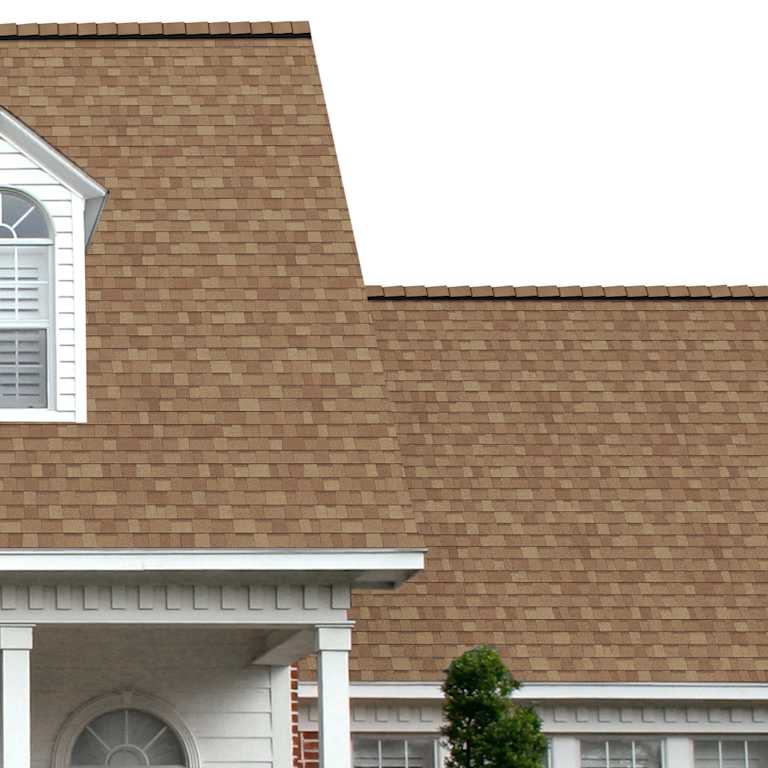 The porch entryway to a home depicts how well Mojave TruDefinition® Duration® COOL golden tan shingles pair with the white horizontal paneling and a woodgrain door with white columns.