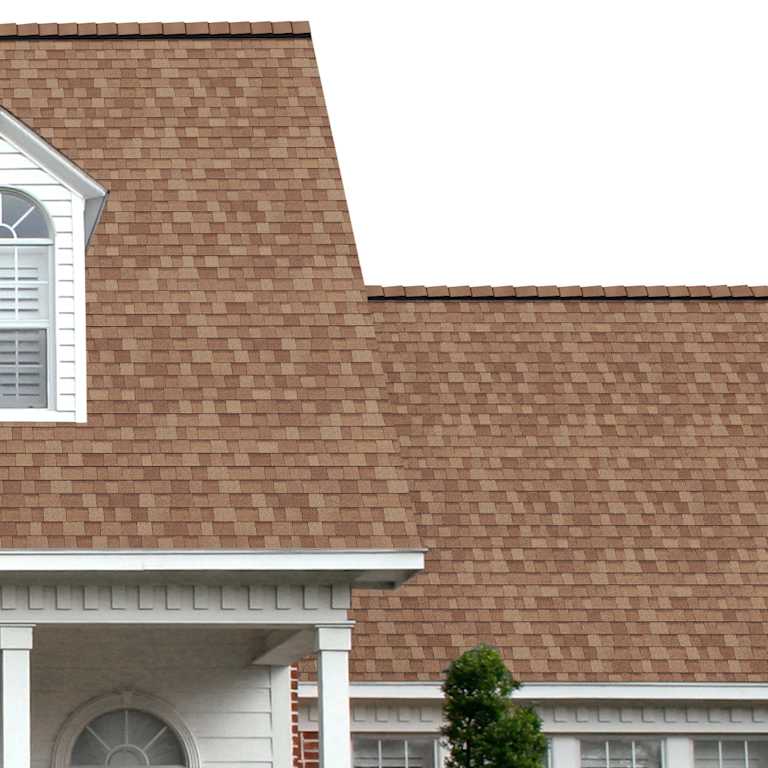 The porch entryway to a home depicts how well Desert Tan Oakridge golden tan shingles pair with the white horizontal paneling and a woodgrain door with white columns.