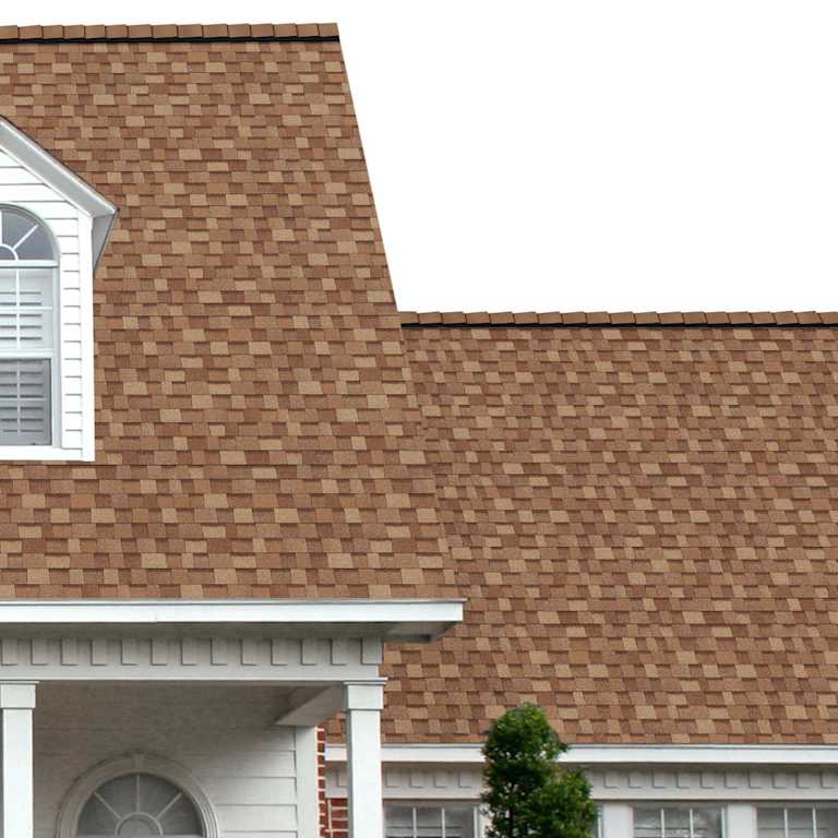 The porch entryway to a home depicts how well Desert Tan TruDefinition® Duration® Storm® golden brown and tan shingles pair with the white horizontal paneling and a woodgrain door with white columns.