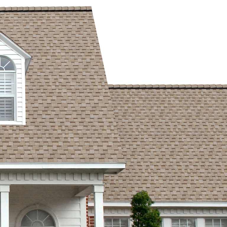 The porch entryway to a home depicts how well TruDefinition® Duration® Cool Amber light tan, dark brown, white, and gray shingles pair with the white horizontal paneling and a woodgrain door with white columns.