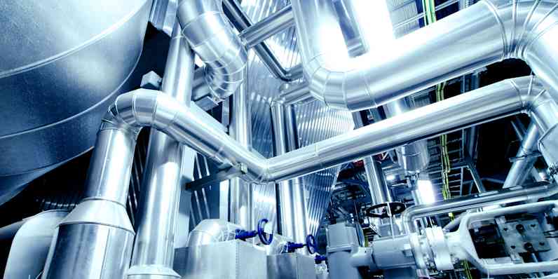 Background showing insulated pipes and elbows in the process industry