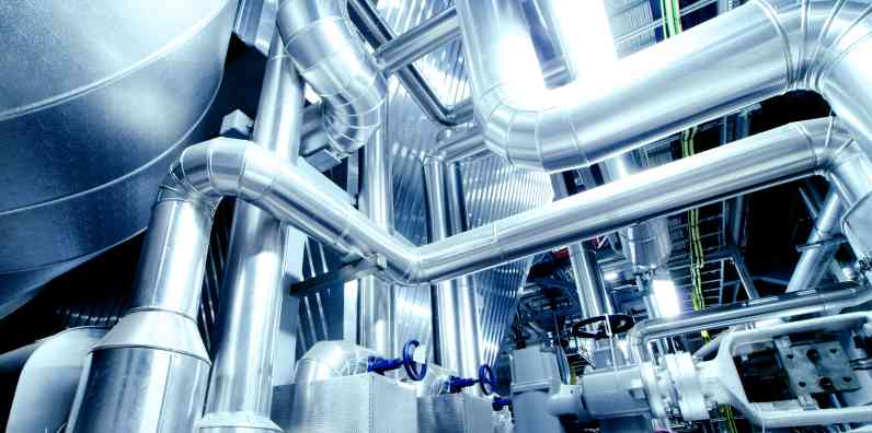 Background showing insulated pipes and elbows in the process industry