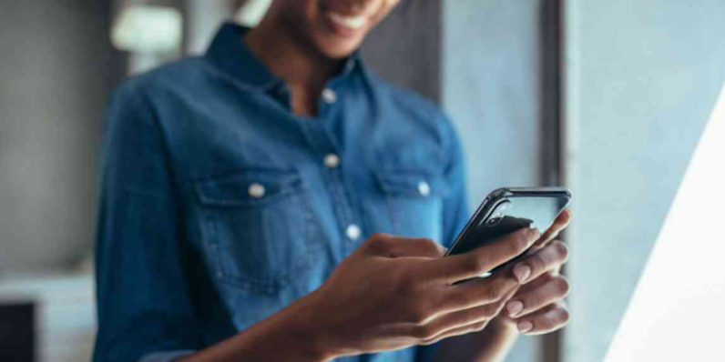 Photo of a person viewing something on their cellphone