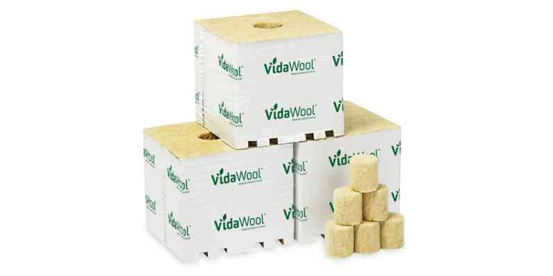 Three VidaWool™ blocks stacked behind a set of five VidaWool™ plugs.