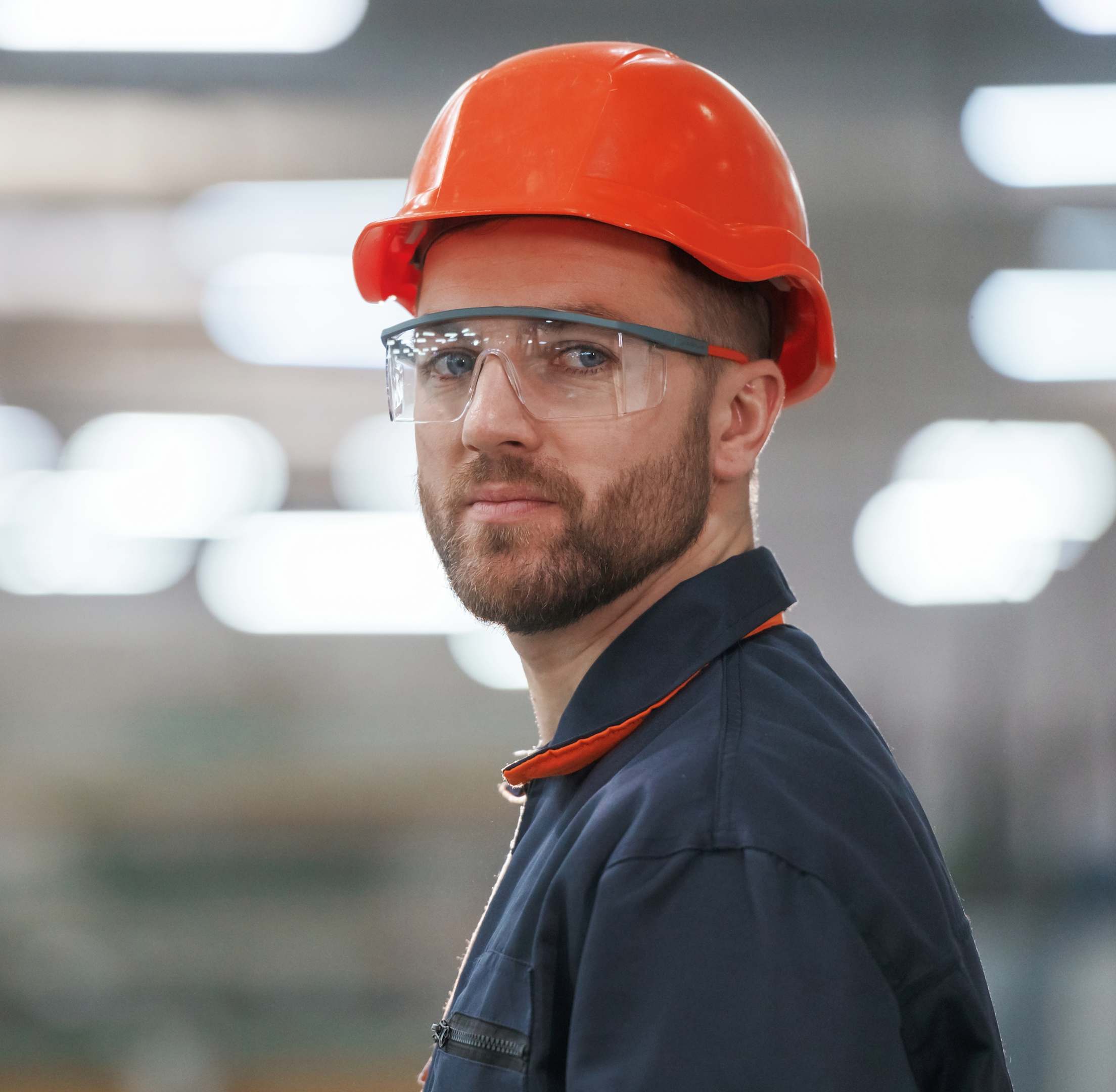Man standing with a security helmet on his head, image