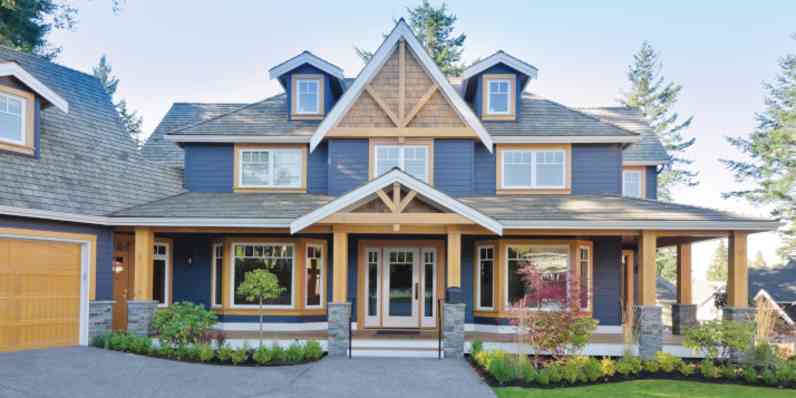 Warm wooden double doors with decorative glass panels.