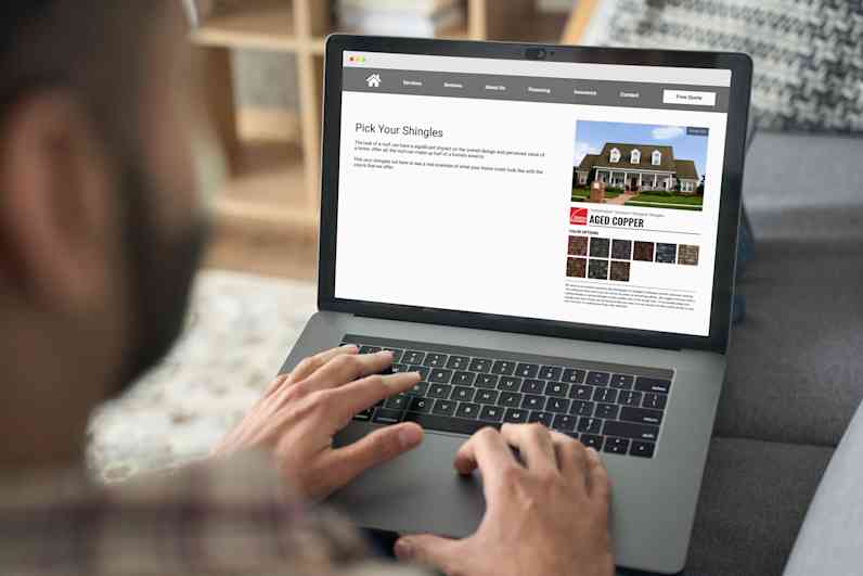 Photo of a person holding a laptop computer with the Pick Your Shingles widget on screen