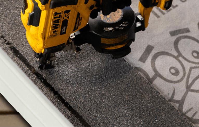 Starter strip being nailed to the roof edge over Weatherlock Specialty Tile & Metal.