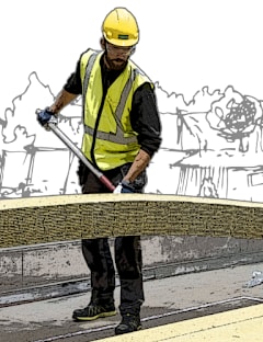 En man i gul hjälm och väst installerar PAROC RTL