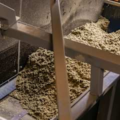 crushed stone wool on the conveyor at OC Paroc Parainen factory waste handling station..