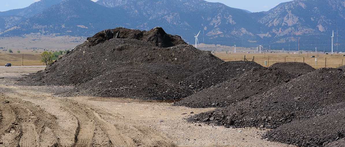 Large pile of ground asphalt outside