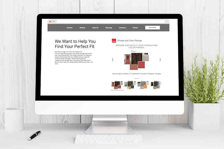 Photo of a large computer screen sitting on a clean white desk with browser open to Owens Corning Design & Inspire Style Boards Widgets page