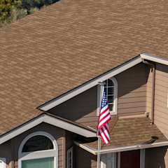 Exterior view of a home with tan siding and Trudefinition Duration COOL Shingles in Mojave color.
