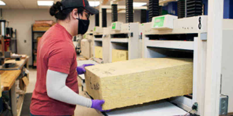 Photo of an employee working in the product test labs