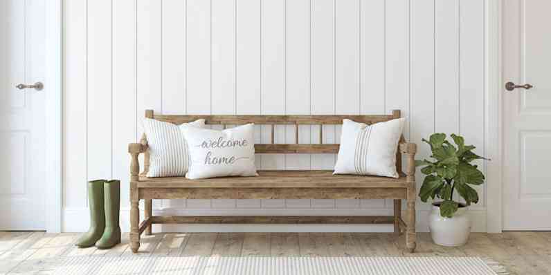 Farmhouse entryway. Wooden bench near white shiplap wall. Interior mockup. 3d render.