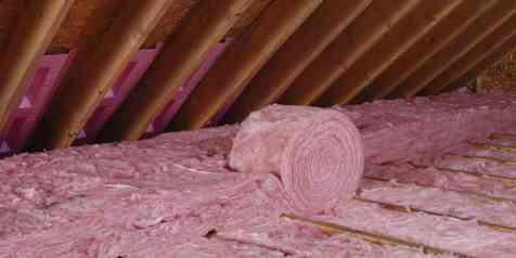 Attic insulation installation using R-30 unfaced rolls in rafters