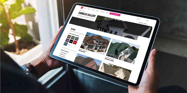Person using a tablet browsing the Owens Corning Shingle Gallery page