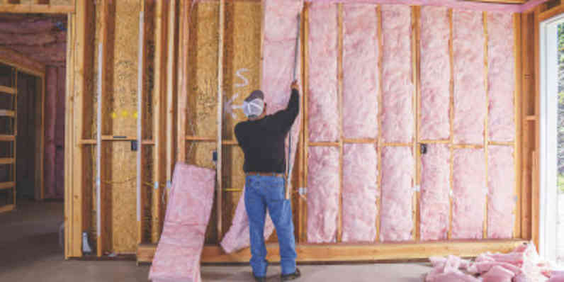 Wall insulation being installed