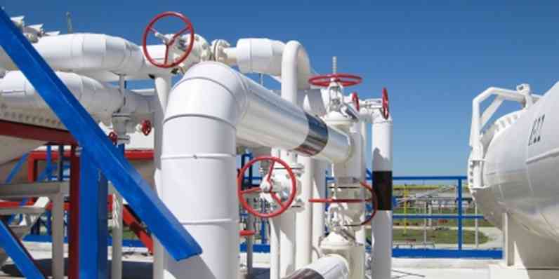 pipes with red valves at oil refinery