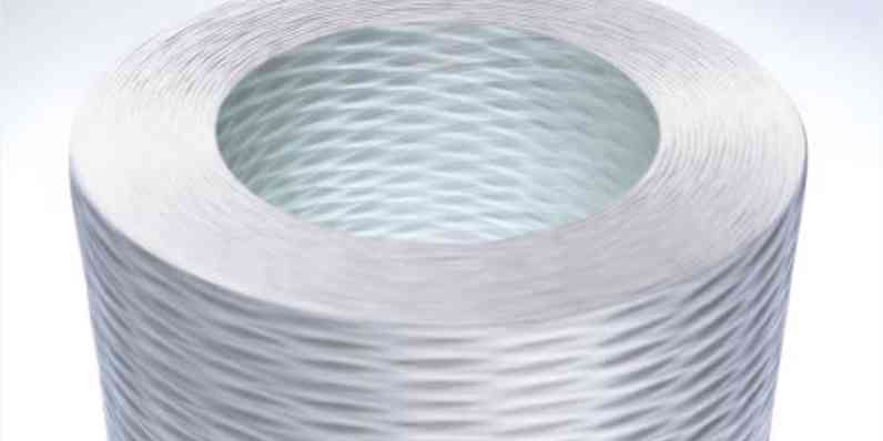Close-up of a cylindrical woven material spool with a hollow center.