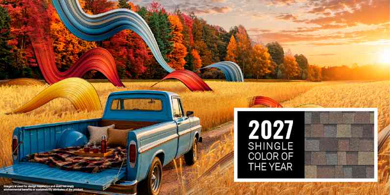 A scene of a bright blue truck driving through a golden field on a dirt road with fall trees, set beside Owens Corning 2027 Shingle Color of the Year, Summer Harvest