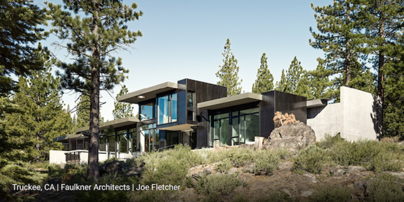 Luxury home with floor to ceiling windows and glass doors, with ascenic view.