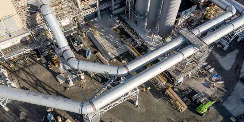 The construction site is seen from a drone perspective.