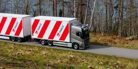 A red and white striped Paroc truck on the road