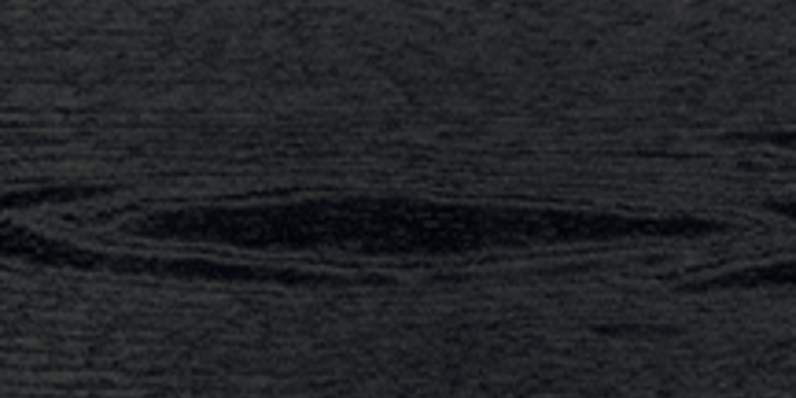 Close-up of a black/obsidian, textured composite decking board with visible wood‑grain pattern.