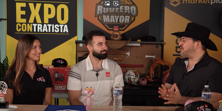 Two individuals talking. He is with a white shirt and she is with a black one.