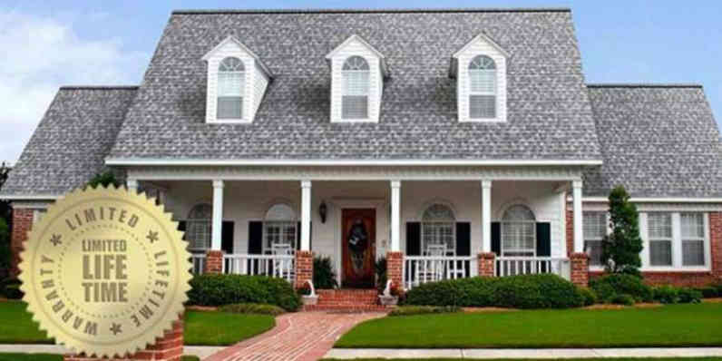 front view of a house with a large limited lifetime warranty sticker next to it