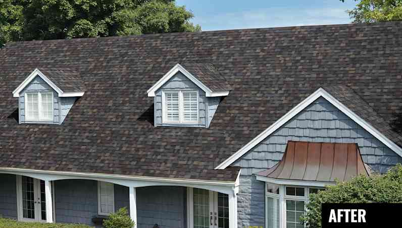 Grey blue house with shake siding, copper awning, white trim, two dormer windows and Black Sable TruDefinition® Duration® Designer shingles from Owens Corning.