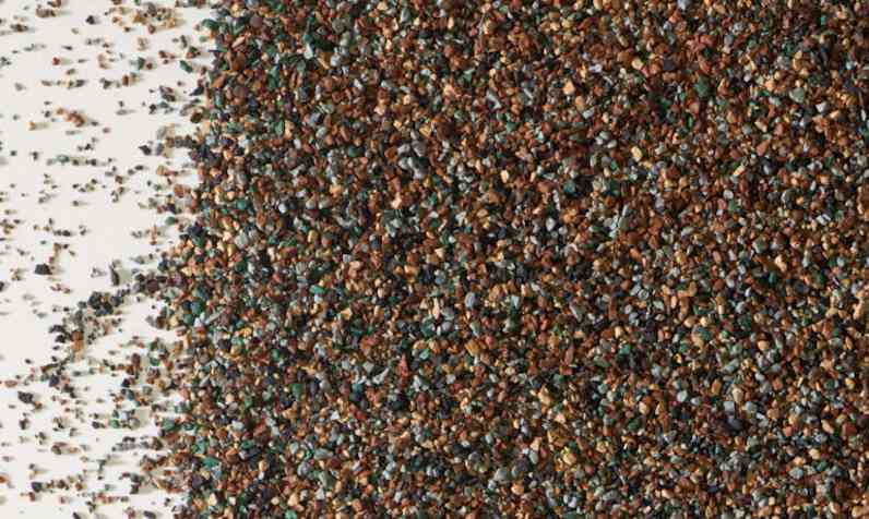 Shingle granules in tan, brown, and green shades
